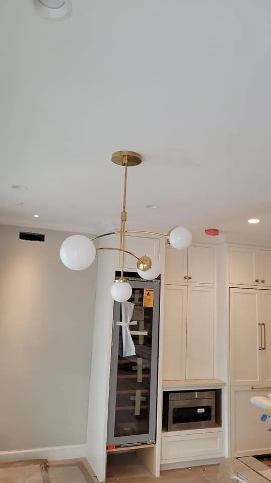 Brass globe pendant, a Storm Electrical job in Massachusetts
