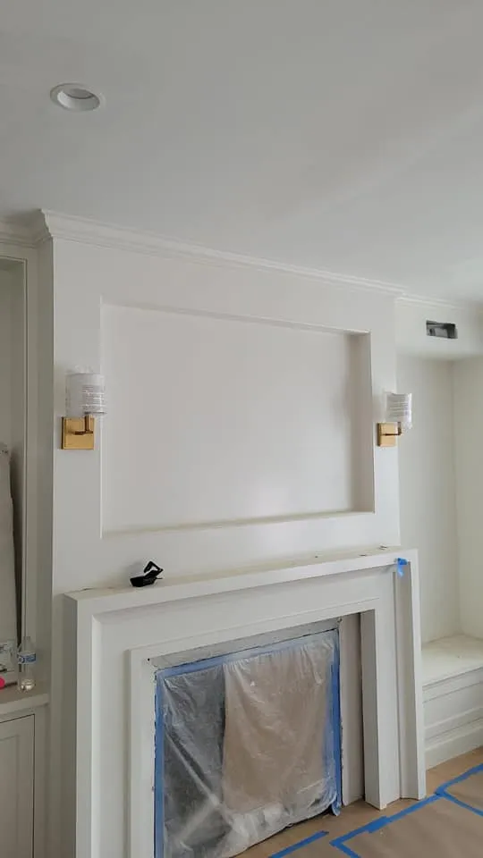 Sconces flanking a fireplace, a Storm Electrical job in Massachusetts